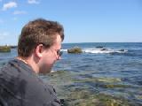 James in profile with sea