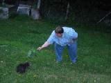 scary woman torturing cat